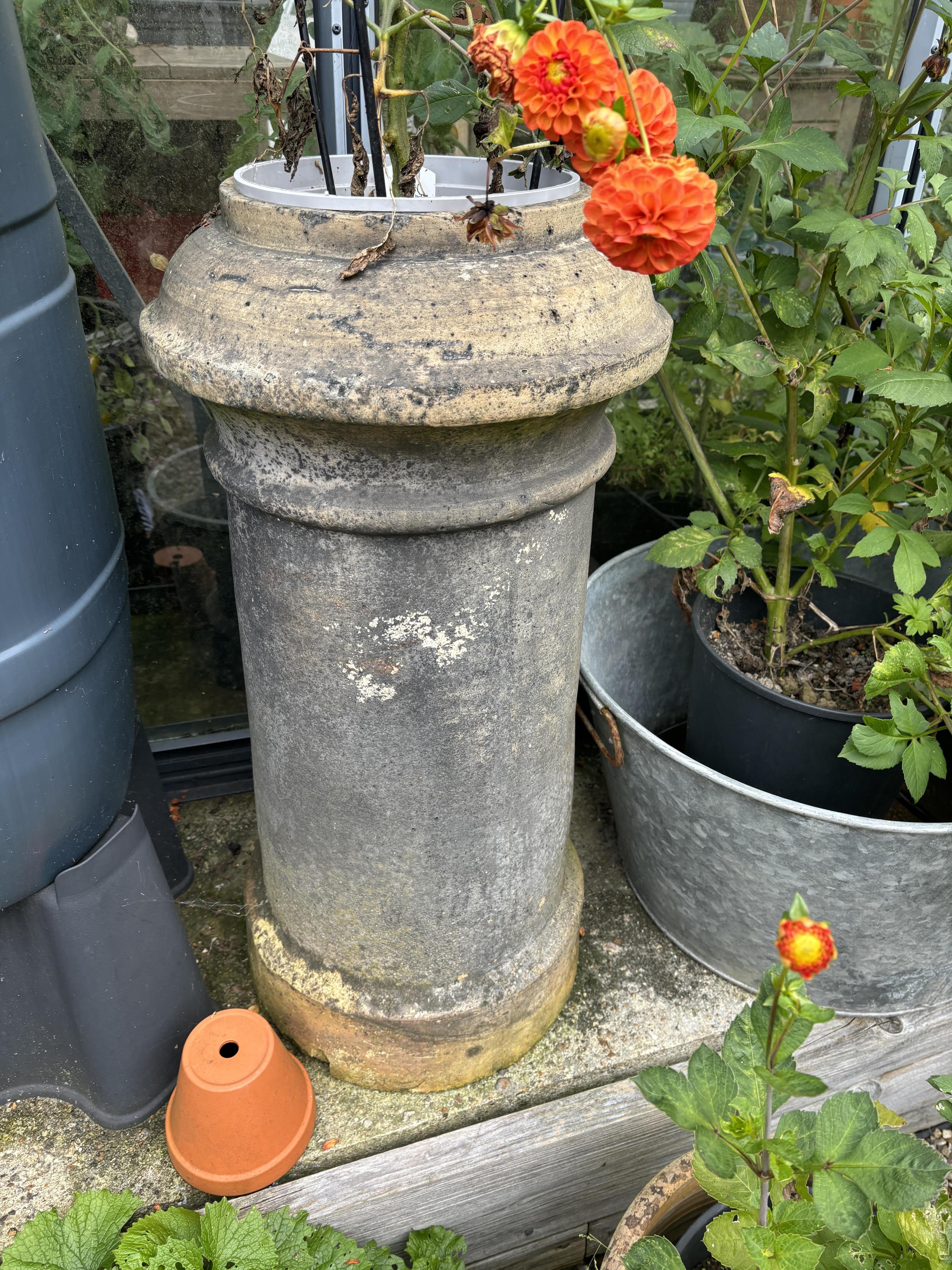 Three assorted terracotta chimney pots, largest height 90cm. Condition - weathered, some small chips otherwise good